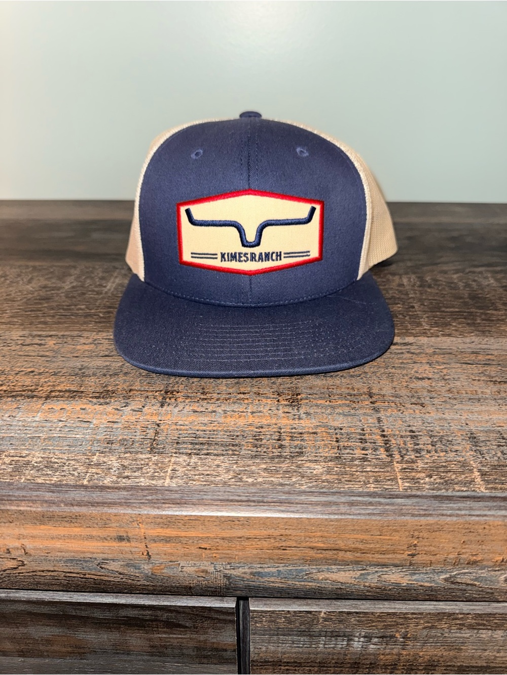 Kimes Ranch Navy Blue and Cream Trucker Cap with Red Trim Patch